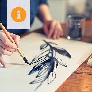 An individual working on a painting